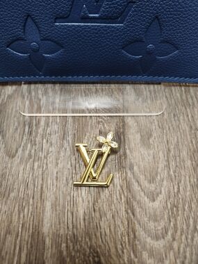Louis Vuitton Gold LV Monogram Pin with Crystal Flower
